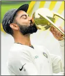  ??  ?? CAREER HIGH: Kohli with trophy