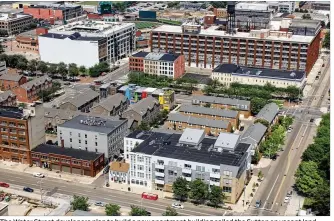  ?? CORNELIUS FROLIK / STAFF ?? The Water Street developers plan to build a new apartment building called the Sutton on vacant land next to the Lincoln Storage building by the Day Air Ballpark, seen in the upper left part of this photo.