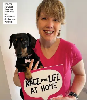  ??  ?? Cancer survivor Heather Duff with her miniature dachshund Parsnip