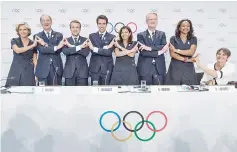  ?? Photo — AFP ?? This file photo taken on July 11, 2017 shows (From L to R) President of the Ile de France Region Valerie Pecresse, French National Olympic Committee President Denis Masseglia , French President Emmanuel Macron (L), Paris 2024 Olympic bid co-president...