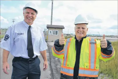  ?? SHARON MONTGOMERY-DUPE/CAPE BRETON POST ?? Don Dickson, right, 74, of Sydney, gives a happy and full “thumbs up” while with Greg McNeil, owner/director of security for SPS Security Atlantic Ltd., while undergoing training for a job with the company Thursday at the Provincial Energy Ventures site in Sydney, one of the industrial sites Dickson will be working at. The Cape Breton Post featured Dickson in a story on Aug. 7 in connection with a humorous ad Dickson had placed in the newspaper in his quest for employment, after not being able to find work since January. McNeil said the story caught his eye and Dickson will be officially starting work next week.