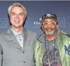  ?? EVAN AGOSTINI/INVISION/AP ?? Byrne, left, and director Spike Lee at the New York Film Festival premiere.