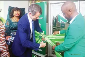  ?? (Pics: Themba Zwane) ?? Minister of Finance Neal Rijkenberg cuts the ribbon to mark the official opening of the Nedbank Buhleni branch on Saturday.