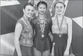  ??  ?? Sharlie Pinksen, Shayleigh Doucet and Allison Theriault were among the Yarmouth Skating Club members to compete at the Nova Scotia StarSkate Provincial Championsh­ip.