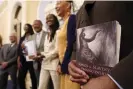  ?? Photograph: Rich Pedroncell­i/AP ?? Dr Amos C Brown Jr, vice-chair for the California reparation­s task force, holds a copy of the book Songs of Slavery and Emancipati­on.