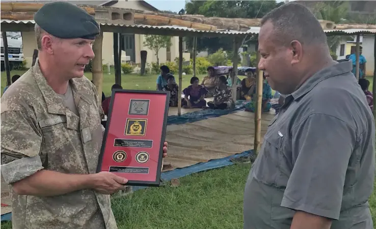  ?? Photo: New Zealand Defence Force ?? New Zealand Defence Force Chief Instructor Major Tim Colliar with the Minister for Defence and National Security, Inia Seruiratu.