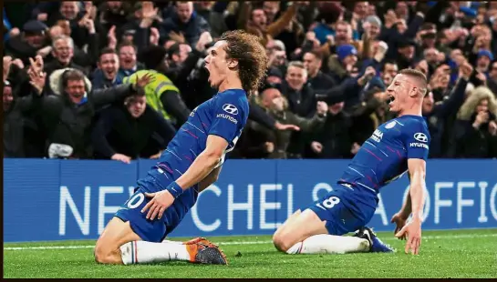  ?? — AFP ?? Rhythm and blues: Chelsea’s David Luiz (left) celebratin­g with Ross Barkley after scoring the second goal against Manchester City.