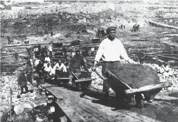  ?? ?? Toiling times Men work in a Soviet labour camp, 1930. It was the job of the ‘gulag doctors’ to ensure that enough inmates could be kept alive to meet the economic demands of the camp system