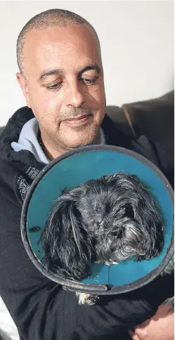  ?? Payne. Picture: Jim ?? Derek Baxter with his dog Millie who lost an eye after being attacked by a staffordsh­ire bull terrier.