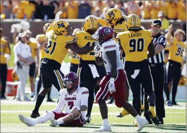  ?? (AP/Colin E Braley) ?? South Carolina quarterbac­k Spencer Rattler (7) sits on the turf Saturday after getting sacked by Missouri during a game in Columbia, Mo. Rattler was sacked six times in a 34-12 loss.