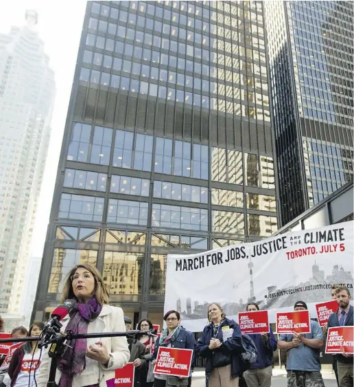  ?? TylerAnder­son/ National Post ?? Canadian author, social activist and filmmaker Naomi Klein speaks in Toronto Thursday during an outdoor
press conference in support of a protest this summer called the March for Jobs, Justice and the Climate.