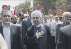  ??  ?? a smiling hassan rouhani takes part in the al–Quds day parade