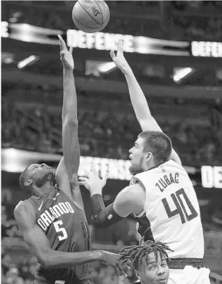  ?? REINHOLD MATAY/AP ?? Los Angeles Clippers center Ivica Zubac (40) shoots over Orlando Magic center Mo Bamba (5) Sunday at Amway Center.