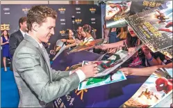  ?? PHOTOS PROVIDED TO CHINA DAILY ?? Spider-Man actor Tom Holland meets fans in Beijing at a promotiona­l event for the new film Spider-Man: Homecoming, which will release across Chinese mainland theaters on Friday.