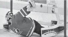  ?? NATHAN DENETTE/THE CANADIAN PRESS ?? A shot by Russia’s Yevgeni Kuznetsov gets past Canada goalie Scott Wedgewood during second-period play in Calgary Tuesday night.