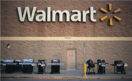  ?? LUKE SHARRETT/BLOOMBERG NEWS ?? Wal-Mart’s net profit fell to $3.34 billion US, or $1.03 US per share, in the first quarter ended April 30, from $3.59 billion US, ($1.11 US per share), a year ago. Analysts were expecting an average profit of $1.04 US per share.
