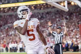  ?? VASHA HUNT — THE ASSOCIATED PRESS ?? Texas wide receiver Adonai Mitchell gestures to the crowd after a touchdown against Alabama during the second half of an NCAA football game Saturday, Sept. 9, 2023 in Tuscaloosa, Ala.