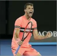  ?? DITA ALANGKARA — THE ASSOCIATED PRESS ?? Bulgaria’s Grigor Dimitrov celebrates after defeating Australia’s Nick Kyrgios during his fourth round match at the Australian Open tennis championsh­ips in Melbourne, Australia Sunday.