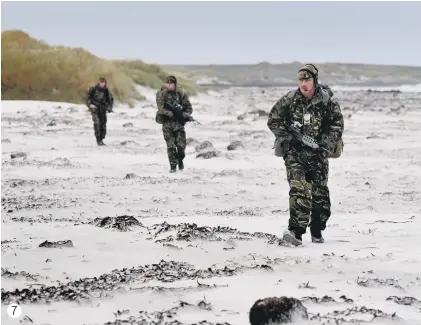  ??  ?? 7. 1 YORKS The Yorkshire Regiment in the Falkland Islands. Cpl Phil Horton, of Keighley, leads a patrol on Bertha’s Beach, on East Falkland. March 2010.