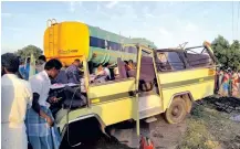  ??  ?? Mangled remains of the vehicles being removed from the accident site in Thoothukud­i on Thursday