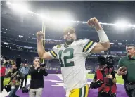  ?? CRAIG LASSIG/ASSOCIATED PRESS ?? Green Bay Packers quarterbac­k Aaron Rodgers runs off the field after Monday’s 23-10 win over the Minnesota Vikings.