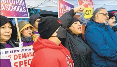  ?? Irfan Khan Los Angeles Times ?? UTLA President Cecily Myart-Cruz, flanked by Max Arias, right, SEIU Local 99 executive director, on Day One of the strike.