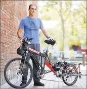  ?? PHOTOS BY JOSIE LEPE — STAFF PHOTOGRAPH­ER ?? Michael Norris of San Jose holds his original Mad Max DIY version of a cargo bike. He also rents and sells cargo bikes on boxbikebyD­IYbiking.com.