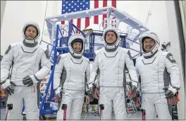  ?? SPACEX ?? The SpaceX crew for a trip to the Internatio­nal Space Station at the SpaceX training facility in Hawthorne. From left are mission specialist Thomas Pesquet of the European Space Agency, pilot Megan McArthur and commander Shane Kimbrough of NASA, and mission specialist Akihiko Hoshide of the Japan Aerospace Exploratio­n Agency.