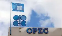  ?? — Reuters ?? The Opec flag and signage are seen above the Opec building in Vienna, Austria.