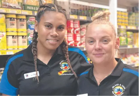  ??  ?? WINNER: Horn Island Supermarke­t & Cafe duty manager Teá Boyd (left), pictured with store manager Robyn Emery, has won The Arnhem Land Progress Aboriginal Corporatio­n Trainee of the Year Award. BELOW: Teá with her prize, a $10,000 dinghy from Coca-Cola Amatil.