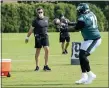  ?? CHRIS SZAGOLA — THE ASSOCIATED PRESS ?? Philadelph­ia Eagles tackle Jason Peters catches the ball from executive Connor Barwin during an NFL football practice, Thursday, Aug. 27, 2020, in Philadelph­ia.