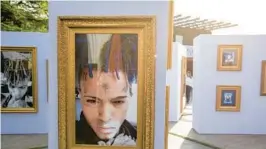  ?? COURTESY AMANDA BARONA/ ?? Fans of the late rapper XXXTentaci­on visit a museum set up during Art Basel in 2019 in Miami that celebrated his late life with various artifacts. Among the items displayed was the car that the late rapper was shot and killed in in June 2018 in Deerfield Beach.