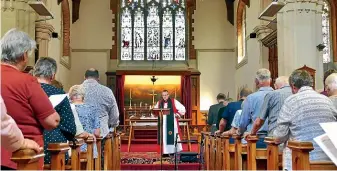  ??  ?? Right Reverend Dr Bishop Steve Benford leads the last service at St John Anglican Church on Tay St, Invercargi­ll, yesterday. JOHN HAWKINS/STUFF