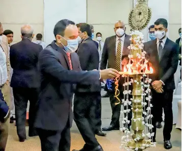  ?? ?? Mr. Nalaka Niroshana (General Manager – NCHS) lighting the lamp at the opening ceremony of EDEX Hybrid Expo 2022