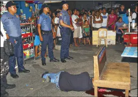  ?? EPA ?? A picture made available yesterday shows tabloid reporter Alex Balcoba slumped on a street after he was shot by an unidentifi­ed gunman in Manila on Friday.