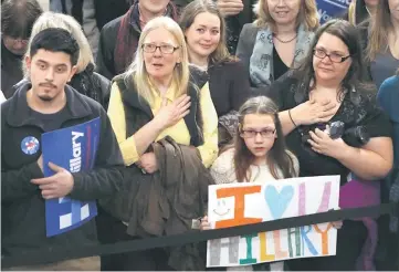  ??  ?? People stand for the national anthem before Hillary Clinton rallies with them at Wood Museum of Springfiel­d History in Springfiel­d, Massachuse­tts. — Reuters photo