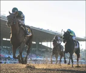  ?? The Associated Press ?? GRADE NO. 1: Accelerate and jockey Joel Rosario, left, outleg Prime Attraction, second from left, with Kent Desormeaux, and Isotherm, with Geovanni Franco, to win the Grade 1 $300,345 Awesome Again Stakes Saturday at Santa Anita Park in Arcadia, Calif. Photo by Benoit Photo.