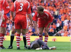  ??  ?? HIGH AND LOWS: Anderson celebrates Aberdeen’s semi-final victory over St Johnstone and (above) Jim Leighton lies injured in the 2000 Scottish Cup Final