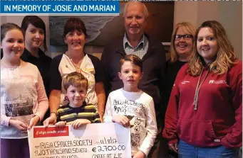  ??  ?? The Donald and McGauran Families from Calry presenting a cheque for €2,700 to Ena Barrett of The Irish Cancer Society. The money was raised from their annual “Coffee at Le-Cachot” fundraiser, in memory of Josie McGauran and Marian McDonald. Back row:...