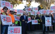  ?? JANIE HAR ?? Protestors gather at a rally and hold signs on behalf of a campaign against Propositio­n 6 during a visit and support by Gov. Jerry Brown on Friday Nov. 2, in Palo Alto, Calif.