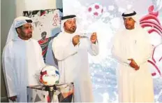  ?? Courtesy: Organiser ?? Mohammad Hassan Khalaf, director-general of the SMC, conducts the name draws as Rashid Al Obaid, director of the Sharjah Sports Channel, and another official look on.