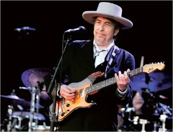  ??  ?? Bob Dylan performs on stage during the 21st edition of the Vieilles Charrues music festival in Carhaix-Plouguer, western France, in 2012. — AFP