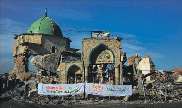  ?? AFP ?? Al Nuri Mosque and the remains of ‘Al Hadba’, its leaning minaret, in Mosul’s war-ravaged Old City during the cornerston­e ceremony yesterday