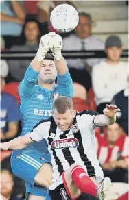  ??  ?? Sunderland keeper Max Stryjek goes up for a high ball.