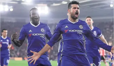  ??  ?? Chelsea’s Diego Costa (foreground) celebrates scoring his side’s second goal against Southampto­n during their English Premier League match at St Mary’s Stadium in Southampto­n, England, yesterday. Chelsea won 2-0.