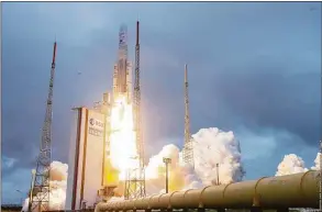  ?? Jim Guillon / Associated Press file photo ?? Arianespac­e's Ariane 5 rocket, with NASA's James Webb Space Telescope onboard, lifts off Dec. 25, 2021, at Europe's Spaceport, the Guiana Space Center in Kourou, French Guiana.