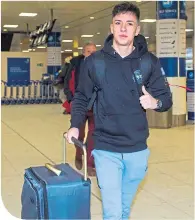  ??  ?? Mikey Johnston headed out from Glasgow Airport with his team-mates yesterday for Celtic’s warm-weather training camp in Dubai