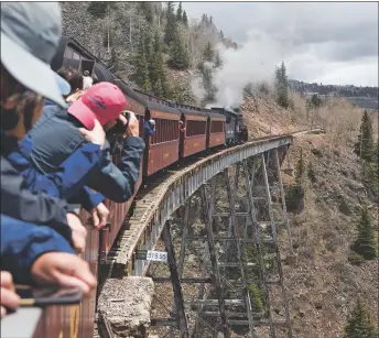  ?? COURTESY PHOTO ?? The Cumbres and Toltec Scenic Railroad once drew tens of thousands of visitors a year like these in 2019 to ride the old steam locomotive between Chama, New Mexico, and Antonito, Colorado. The pandemic shut the train down but it is relaunchin­g this fall with COVID-19 safe practices.