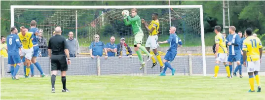  ?? Paul Watson ?? Runcorn Town’s defence is put under pressure during their pre-season clash with Warrington Town at Pavilions last Saturday afternoon, a match the visitors won 4-0.