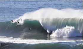  ?? Marcio Jose Sanchez / Associated Press 2016 ?? Mavericks in Half Moon Bay is one of the famed big-wave beaches that inspired California officials to declare surfing the official state sport.